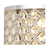 Close-up of the Sasha 2 Light E14 Wall Light in polished chrome, showing a lattice of clear crystal glass with illuminated candle bulbs glowing behind opal white diffusers.