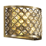 Sasha 2 Light E14 Wall Light in Antique Brass, a curved half-drum fixture with a lattice of clear faceted crystals, shown lit against a plain white background.