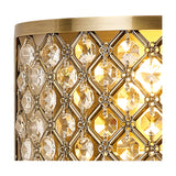 Close-up of the Sasha 2 Light E14 Wall Light in antique brass, showing a diamond-patterned trellis of clear faceted crystals over a warm illuminated glass shade.