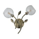 Elm G9 2 Shade Wall Light in antique brass, featuring two curved arms with leaf details and clear ribbed glass shades holding G9 bulbs, shown on a plain white background.