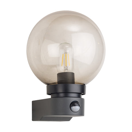 Milo IP54 Globe Outdoor Wall Light in dark grey, with smoke-tinted polycarbonate globe, E27 filament bulb, and built-in PIR sensor, shown on a plain white background.