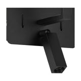 Close-up of the Clara wall light's satin black backplate showing the adjustable LED reading light head and E27 lampholder bracket.