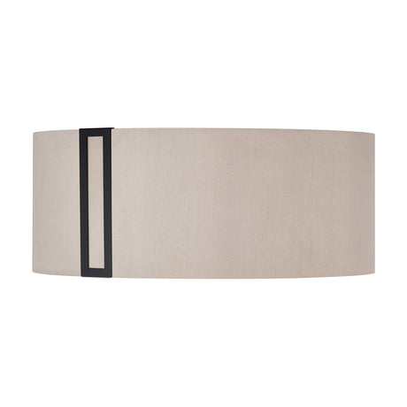 Sigma Lamp Shade 20cm High in oval drum shape with beige fabric and a satin black vertical trim bracket, shown on a plain white background.