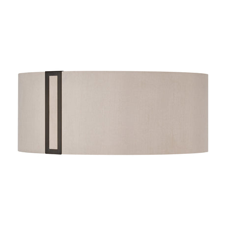 Sigma Lamp Shade 20cm High in Bronze, an oval drum-style shade in cream fabric with a slim bronze vertical trim on one side, shown on a plain white background.