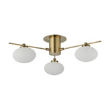 Addie 3 Light G9 Flush Ceiling Light in antique brass, with three oval opal glass globes on angled arms extending from a central round backplate, shown on a white background.