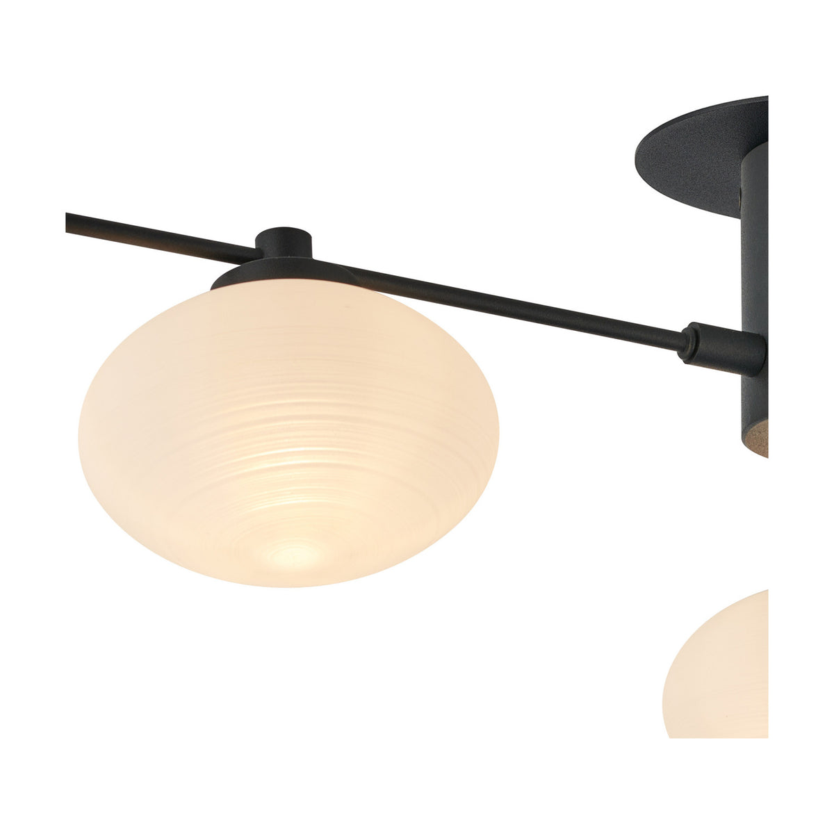 Close-up of the Addie 3 Light G9 Flush Ceiling Light in satin black, showing an opal glass shade glowing softly against the black backplate and arm.