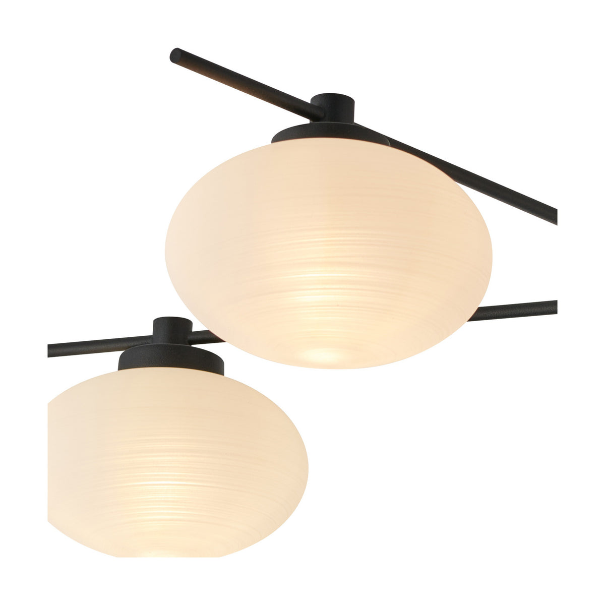 Addie 5 Light G9 Flush Ceiling Light 60cm in satin black, close-up of two round opal glass shades glowing softly on angled black arms against a white background.