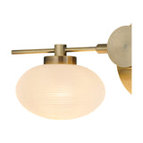 Close-up of the Addie 2 Light G9 Wall Light in antique brass, showing a horizontal bar with oval opal glass shade on a round wall mount, set against a plain white background.