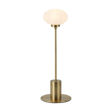 Addie G9 Table Lamp in antique brass with an oval opal glass shade on a slim stem and round base, shown on a plain white background.