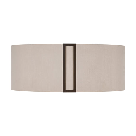 Oval drum lampshade in light beige fabric with a slim bronze Sigma Shade Clip running vertically down its centre, shown on a plain white background.