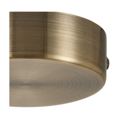 Close-up of the Hayes Round No-Hole Ceiling Rose 80mm in antique brass, showing its brushed cylindrical side and solid closed underside with no central hole, set against a white background.