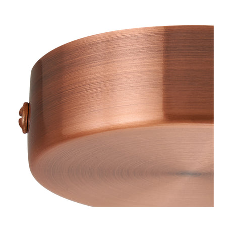 Close-up of the Hayes Round No-Hole Ceiling Rose 80mm in antique copper, showing its smooth cylindrical body with a warm brushed finish and small side screw, set against a plain white background.