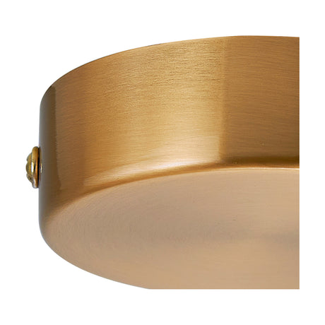 Close-up of the Hayes Round No-Hole Ceiling Rose 80mm in brass, showing its shallow drum shape and warm golden metal finish against a plain white background.