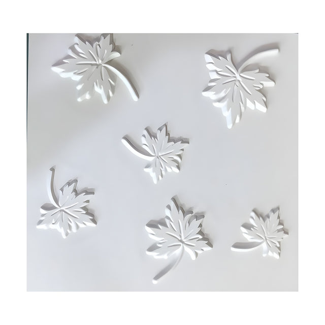 White 3D PVC wall panel, 50 x 50cm square, featuring six raised maple leaves with incised veins and curved stems scattered across a plain white ground.