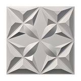 White 3D PVC wall panel, 50 x 50cm, with a faceted star and petal geometric relief in four repeating sections, shown on a plain white background.
