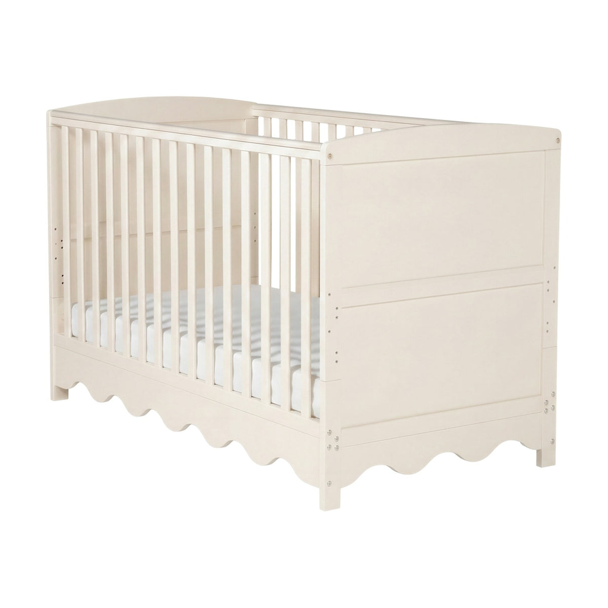 Dancer cot bed in Cashmere finish, MDF construction with slatted sides, scalloped skirt panel and adjustable base, shown on a plain white background.
