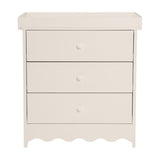 Dancer changing table in cashmere, MDF with removable top tray, three drawers with round knobs and scalloped base, shown on a plain white background.