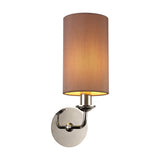 Banyan E14 wall light with a single cylindrical taupe fabric shade and gold lining, mounted on a curved polished chrome arm and round wall plate, shown on a plain white background.