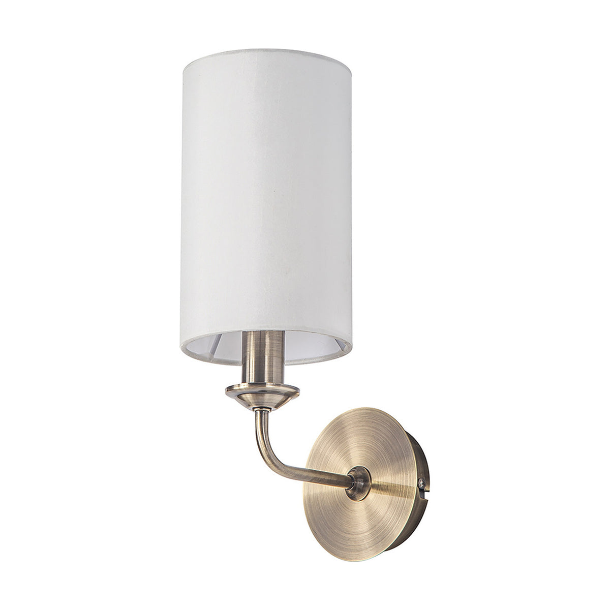 Banyan E14 wall light with a white cylindrical fabric shade on an antique brass curved arm and round wall-mounted base, shown on a plain white background.