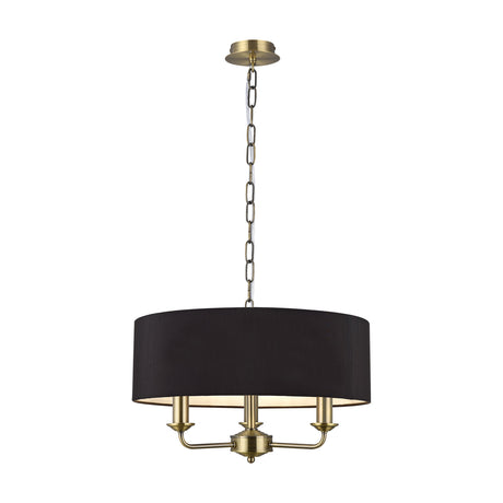 Banyan 3 Light E14 pendant light with a 45cm black drum shade, antique brass chain and three candle arms, shown on a plain white background.