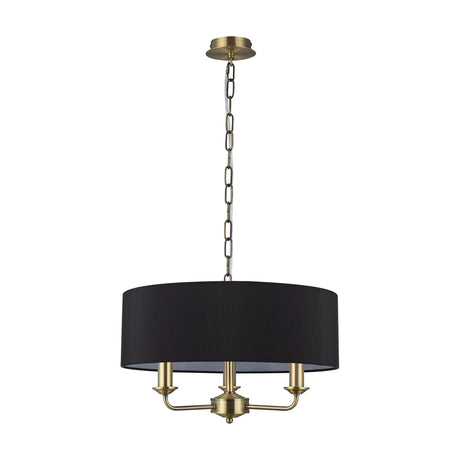 Banyan 3 Light E14 pendant light with a 45cm black fabric drum shade and antique brass ceiling rose, chain, and three candle-style arms, shown against a plain white background.
