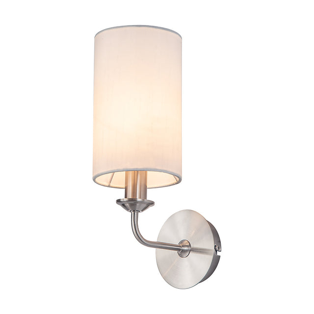 Banyan E14 wall light with a slim white faux silk drum shade on a satin nickel arm and round backplate with integrated switch, shown on a plain white background.