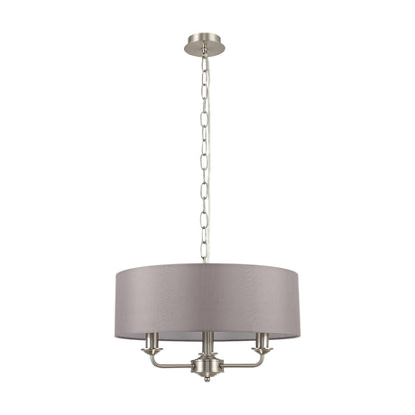 Banyan 3 Light E14 Iron Pendant Light, a satin nickel fitting with a wide grey fabric drum shade and three candle arms beneath, hung from a chain on a plain white background.