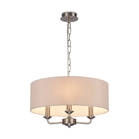 Banyan 3 Light E14 Pendant Light with nude beige 45cm fabric drum shade on satin nickel chain and three-arm frame, shown on a plain white background.