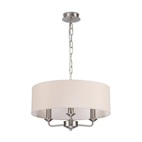 Banyan 3 Light E14 pendant light with a 45cm nude beige fabric drum shade, satin nickel frame and chain suspension, shown on a plain white background.