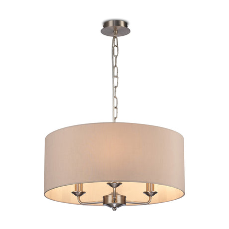 Banyan 3 Light E14 Pendant Light with satin nickel chain and three curved arms beneath a 50cm nude beige fabric drum shade, shown on a plain white background.