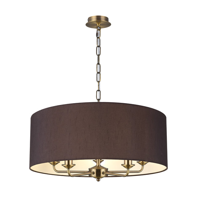 Banyan 5 Light E14 pendant light with a 60cm black drum shade and five candle arms in antique brass finish, shown on a plain white background.