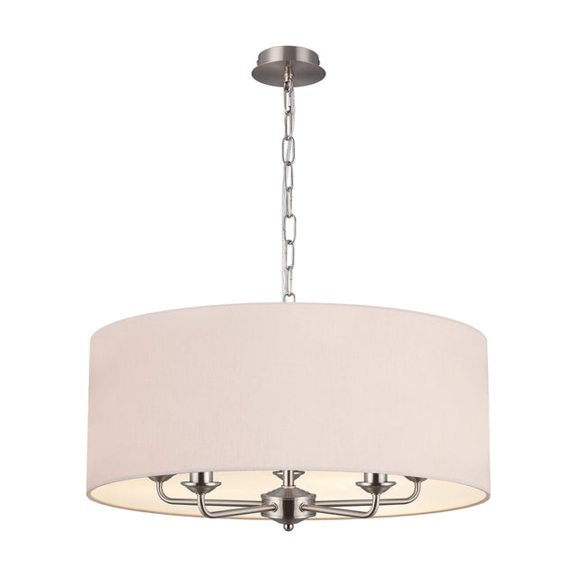 Banyan 5 Light E14 Pendant Light with nude beige drum shade and five satin nickel arms, suspended by a chain from a round ceiling plate on a plain white background.