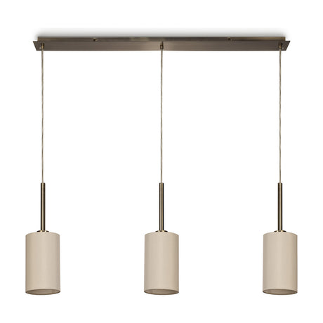 Baymont 3 Light E27 Pendant Light with antique brass linear bar and cables, holding three cylindrical ivory fabric shades, shown on a plain white background.