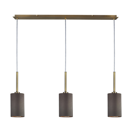 Baymont 3 Light E27 pendant light with grey fabric drum shades on antique brass stems and ceiling bar, 1.07m drop, shown on a plain white background.