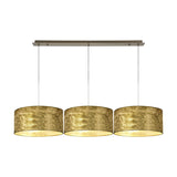Baymont 3 Light E27 pendant light with linear ceiling bar, three round drum shades in gold-flecked antique brass finish, on a white background.