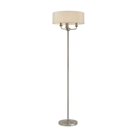 Banyan 3 Light E14 Floor Lamp with a 45cm nude beige drum shade on a slender polished nickel stem and round base, shown against a plain white background.