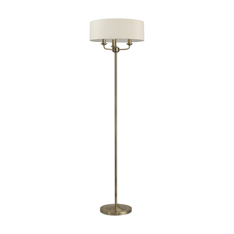 Banyan 3 Light E14 Floor Lamp with a slim antique brass stem, round base, and ivory pearl drum shade on three arms, shown on a plain white background.