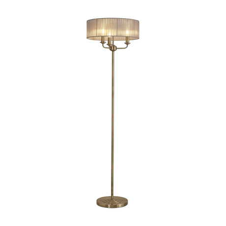 Banyan 3 Light E14 Floor Lamp with a grey gathered organza drum shade on an antique brass stand and round base, shown on a plain white background.