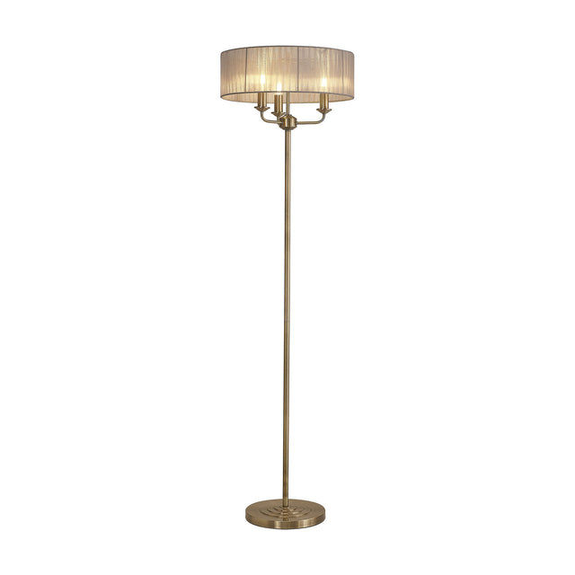 Banyan 3 Light E14 Floor Lamp with a grey gathered organza drum shade on an antique brass stand and round base, shown on a plain white background.