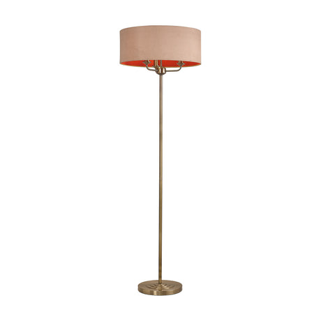 Banyan 3 Light E14 Floor Lamp in antique brass with a wide fabric drum shade on a slender column base, shown on a plain white background.
