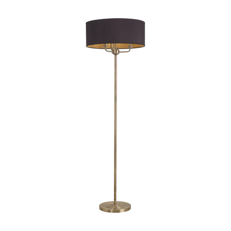 Banyan 3 Light Floor Lamp with antique brass stem and round base, wide midnight black drum shade, on a plain white background.