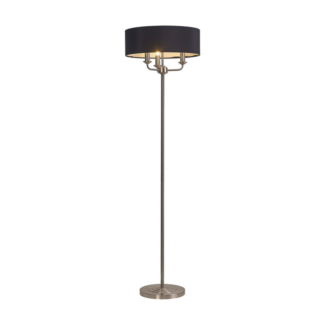 Banyan 3 Light E14 floor lamp with a black faux silk drum shade on a slim satin nickel column and round weighted base, shown on a plain white background.