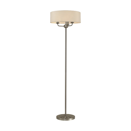 Banyan 3 Light E14 Floor Lamp with a 45cm nude beige drum shade on a slim satin nickel stem and round base, shown on a plain white background.