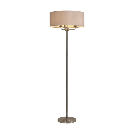 Banyan 3 Light E14 floor lamp with a 50cm nude beige drum shade on a slender satin nickel stem and round base, shown on a plain white background.