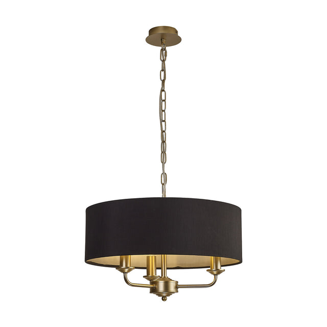 Banyan 3 Light E14 pendant light with a 45cm black faux silk drum shade, champagne gold chain and candle arms, shown on a plain white background.
