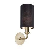 Banyan E14 wall light with a cylindrical black faux silk shade and a curved champagne gold arm and round wall bracket, shown on a plain white background.