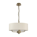 Banyan 3 Light Pendant, champagne gold body with three arms beneath a 45cm ivory pearl drum shade, hung from a chain, on a plain white background.
