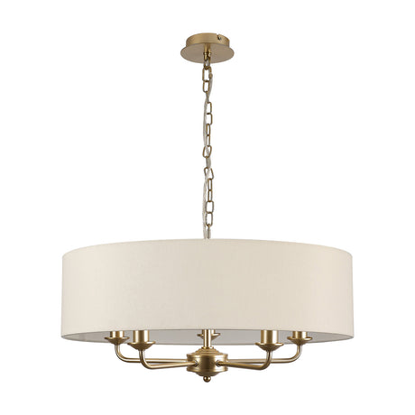 Banyan 5 Light Pendant in Ivory Pearl, a champagne gold fixture with five candle arms beneath a 60cm ivory drum shade, shown on a plain white background.