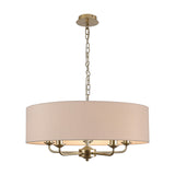 Banyan 5-light pendant with a 60cm nude beige fabric drum shade on champagne gold arms and chain, shown against a plain white background.