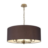 Banyan pendant light with a wide black fabric drum shade, white inner lining, and five champagne gold arms on a chain suspension, shown on a plain white background.